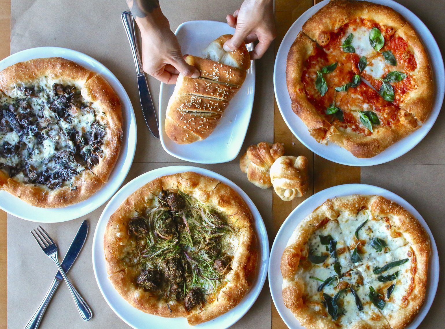 Pizza spread flat lay - 10 Most Iconic LA Restaurants