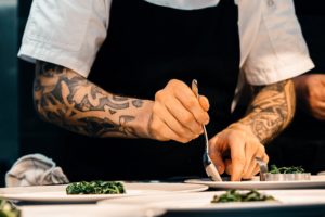 Chef preparing plates of food